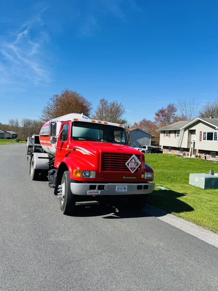 Superior Services propane truck at a home during a residential delivery
